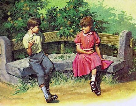мальчик и девочка на скамейке в саду